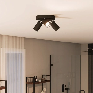 Zwarte ronde plafondspot met drie verstelbare lichtspots in moderne badkamer