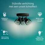 Ronde zwarte plafondspot met drie gerookt glazen kappen en zichtbare lampen