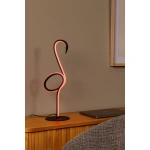 Flamingo tafellamp met rood licht op houten kast in woonkamer.