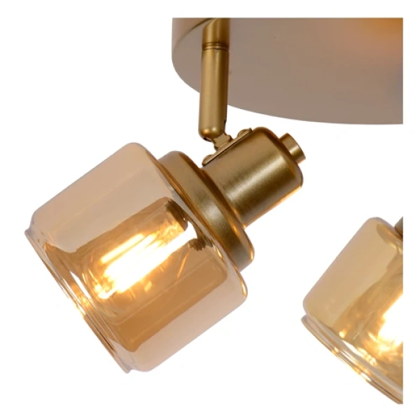 Gouden messing plafondspot met drie verstelbare lichtpunten en warme gloed