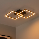 Zwarte LED plafonnière met twee vierkante lichtframes in warme gloed