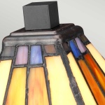 Tafellamp Tiffany glas in geel oranje en blauw met bronzen afwerking