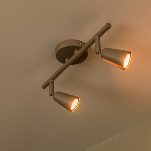 Taupe wandspot met twee verstelbare lichtpunten in metalen uitvoering
