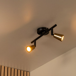 Twee-lichts wandspot in champagnekleur met warme lichtbundel aan plafond