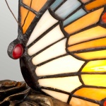 Vlinder tafellamp met glas-in-lood vleugels in oranje en crème tinten